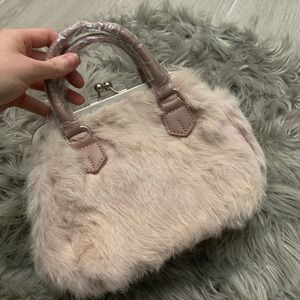 Muted baby pink fur handbag